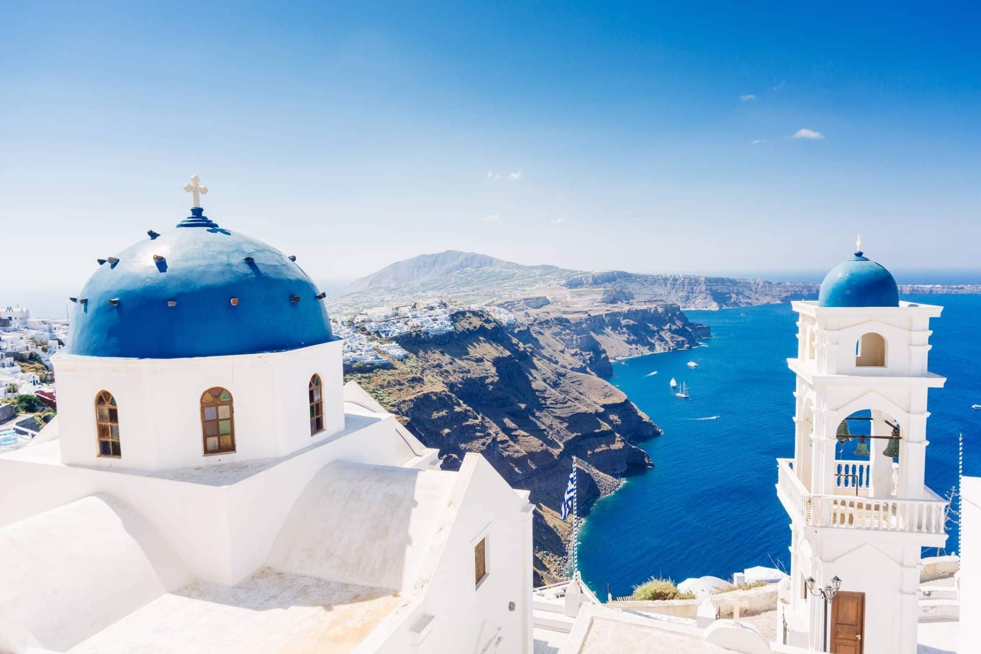 Imerovigli blue dome churches overlooking the caldera