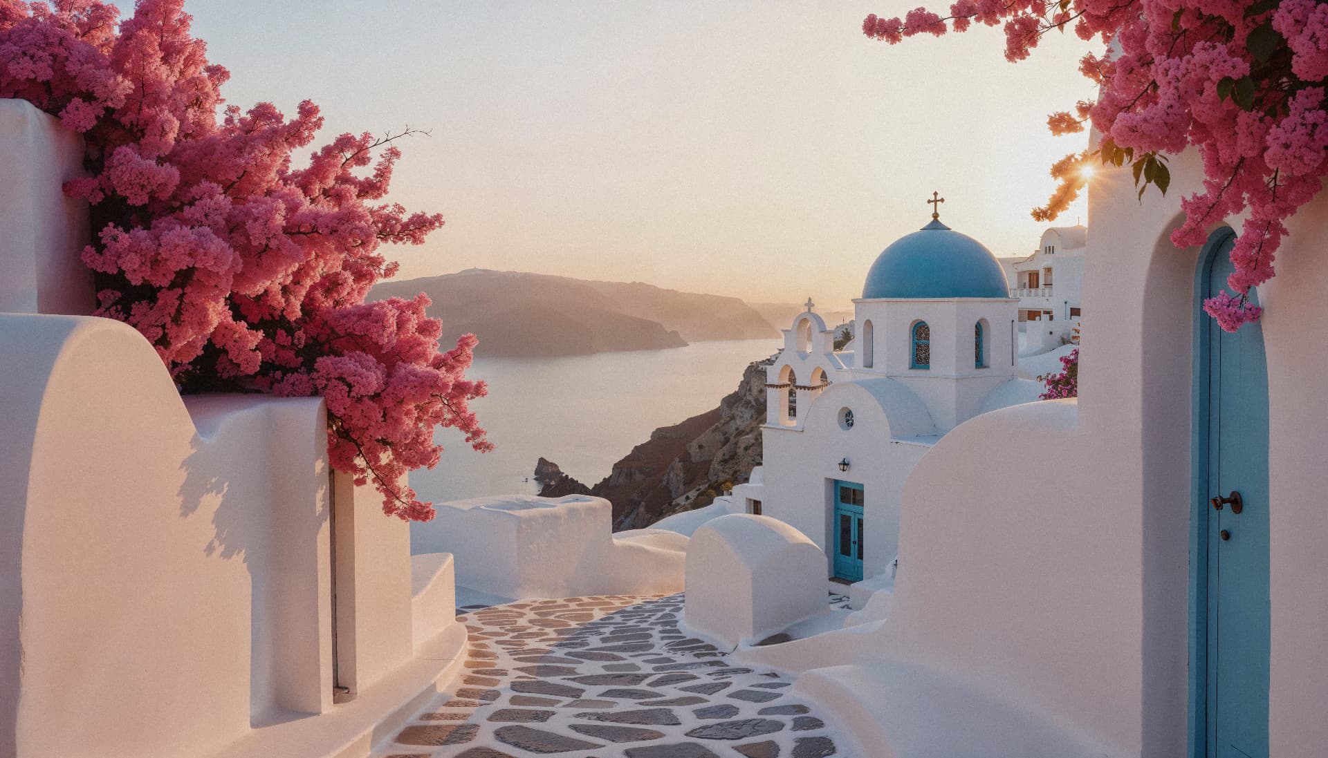 Santorini blue dome church with bougainvillea at sunset